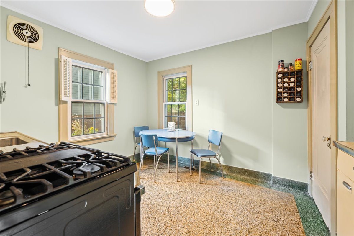501 Dodson Street Geneva, IL 60134 - Photo 9 of 23 a living room with a stove and a window