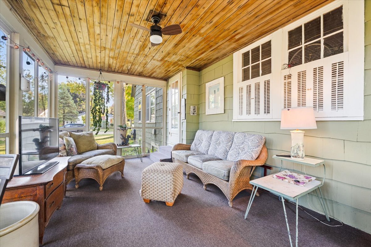 501 Dodson Street Geneva, IL 60134 - Photo 10 of 23 a living room with furniture and a floor to ceiling window