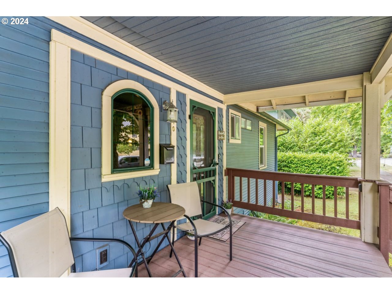 1040 Jefferson Street Eugene, OR 97402 - Photo 16 of 36 a view of a patio with table and chairs with wooden floor and fence