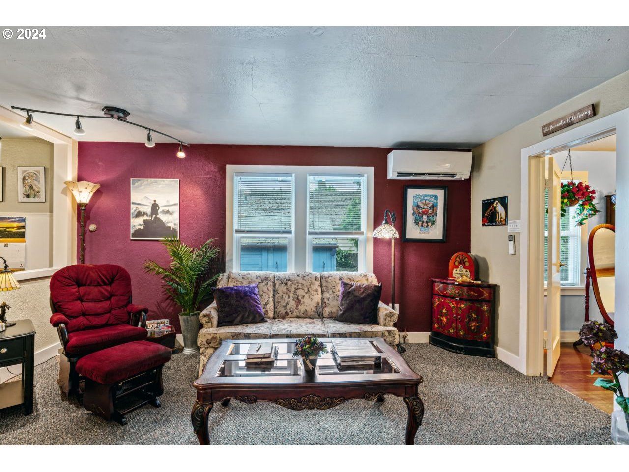 1040 Jefferson Street Eugene, OR 97402 - Photo 2 of 36 a living room with furniture a window and gym equipment