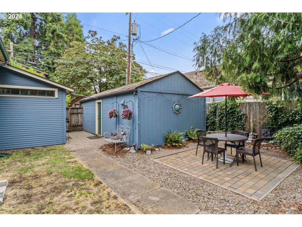 1040 Jefferson Street Eugene, OR 97402 - Photo 26 of 36 a patio with table and chairs under an umbrella