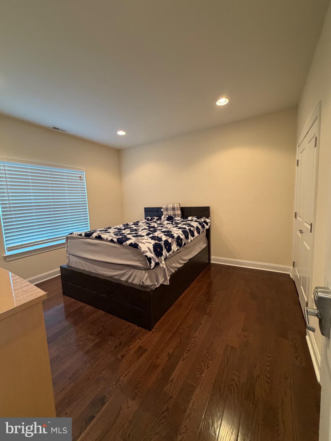 7804 Large Street Philadelphia, PA 19152 - Photo 12 of 42 a spacious bedroom with a bed and a table in it