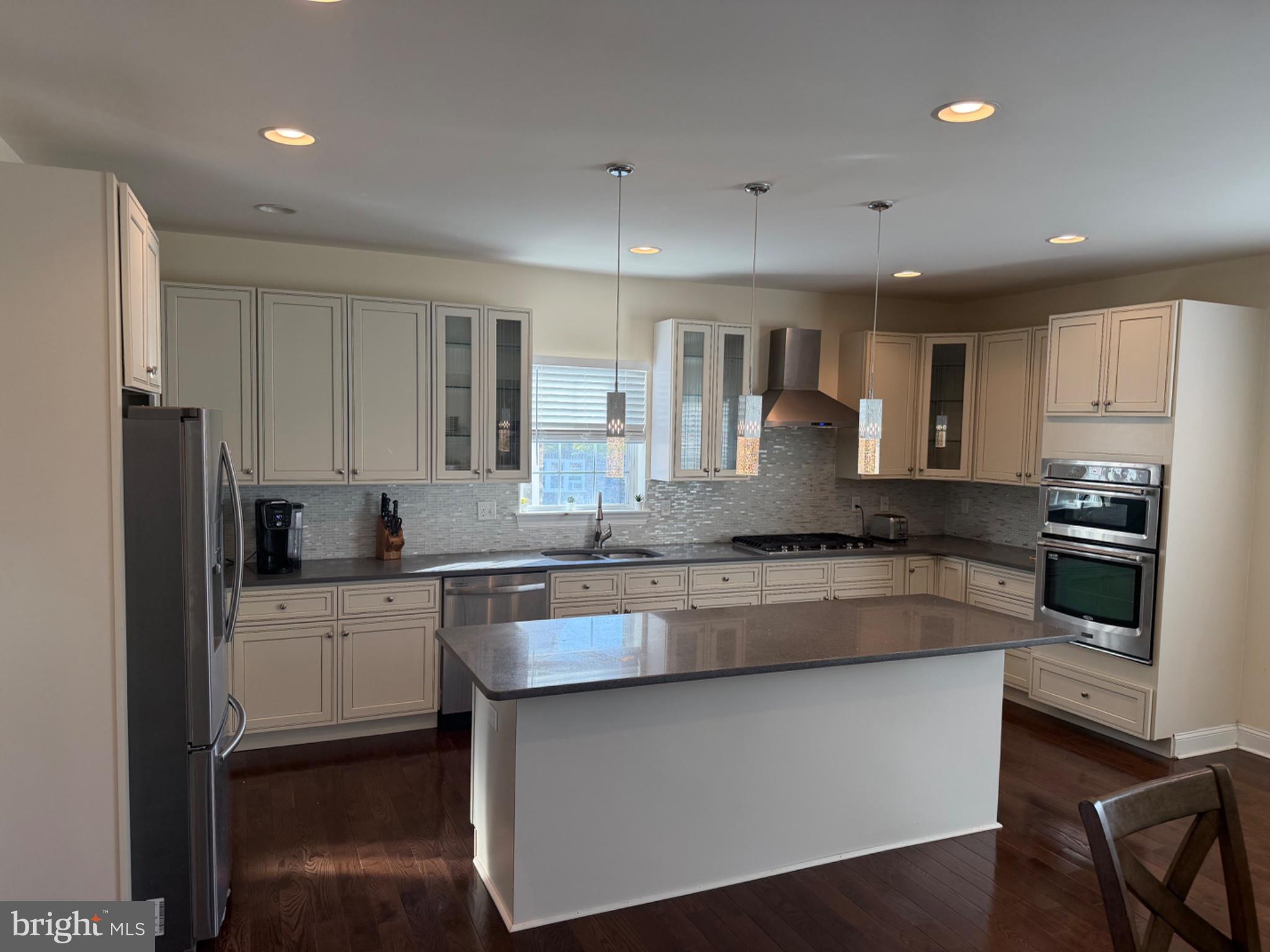 7804 Large Street Philadelphia, PA 19152 - Photo 18 of 42 a large kitchen with granite countertop a large counter top stainless steel appliances and cabinets