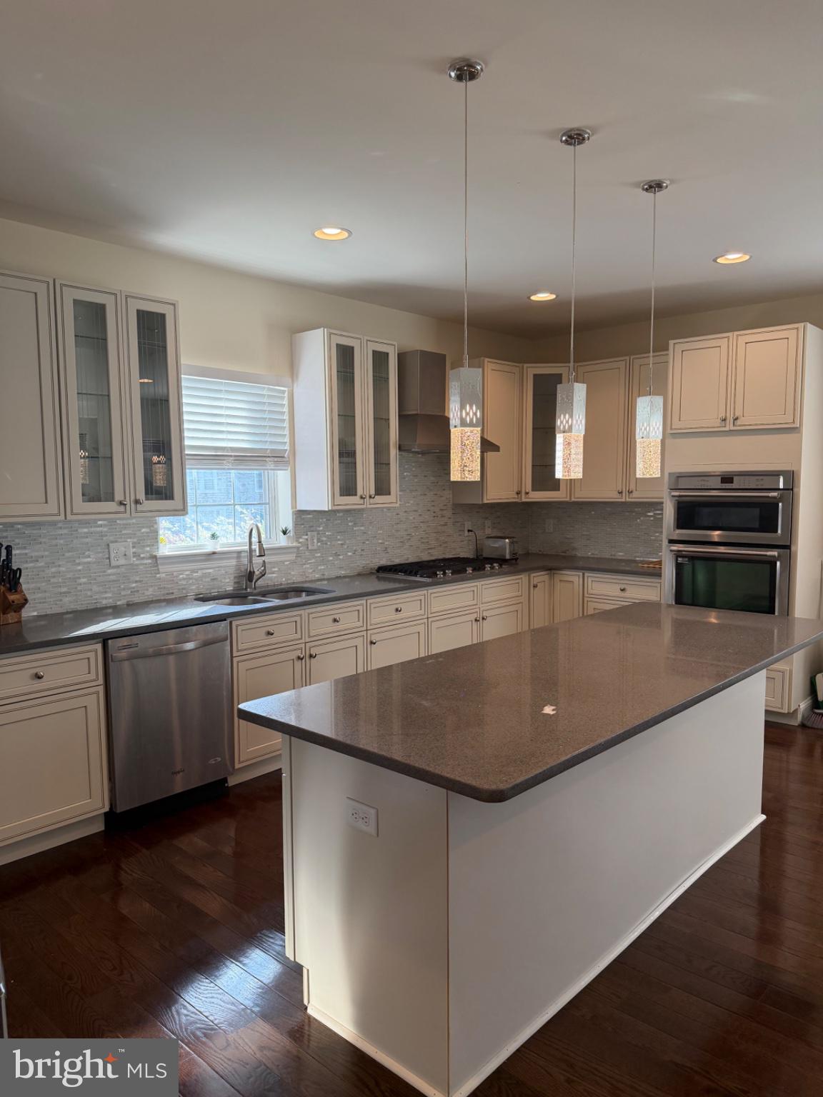 7804 Large Street Philadelphia, PA 19152 - Photo 19 of 42 a kitchen with kitchen island granite countertop a sink a counter space appliances and cabinets