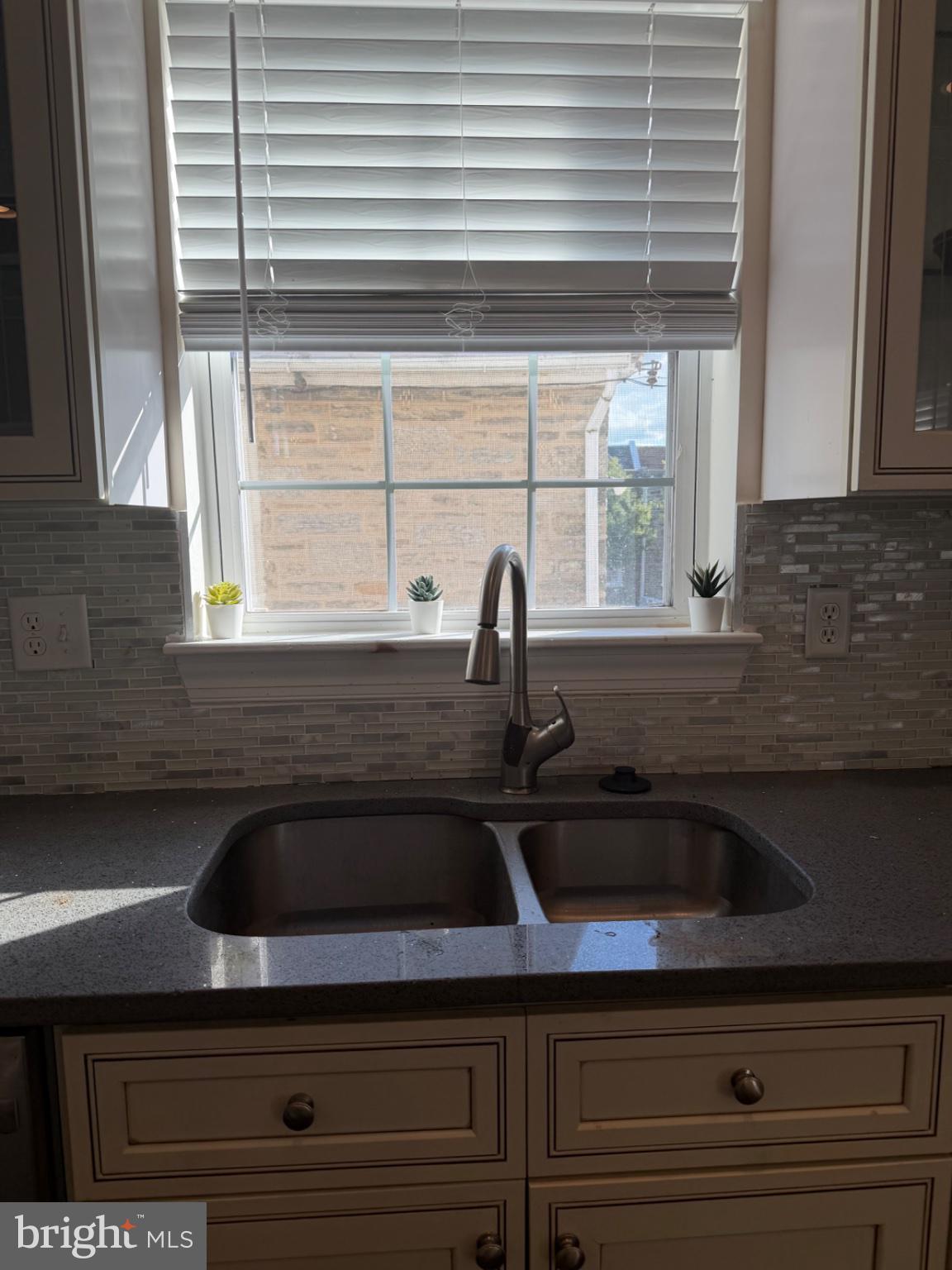 7804 Large Street Philadelphia, PA 19152 - Photo 23 of 42 a kitchen with a sink and cabinets