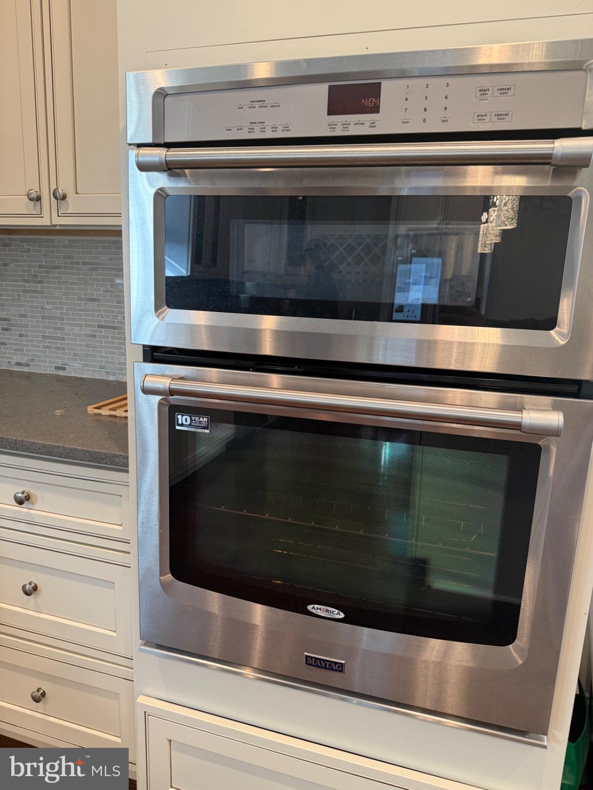 7804 Large Street Philadelphia, PA 19152 - Photo 25 of 42 a stove top oven sitting inside of a kitchen