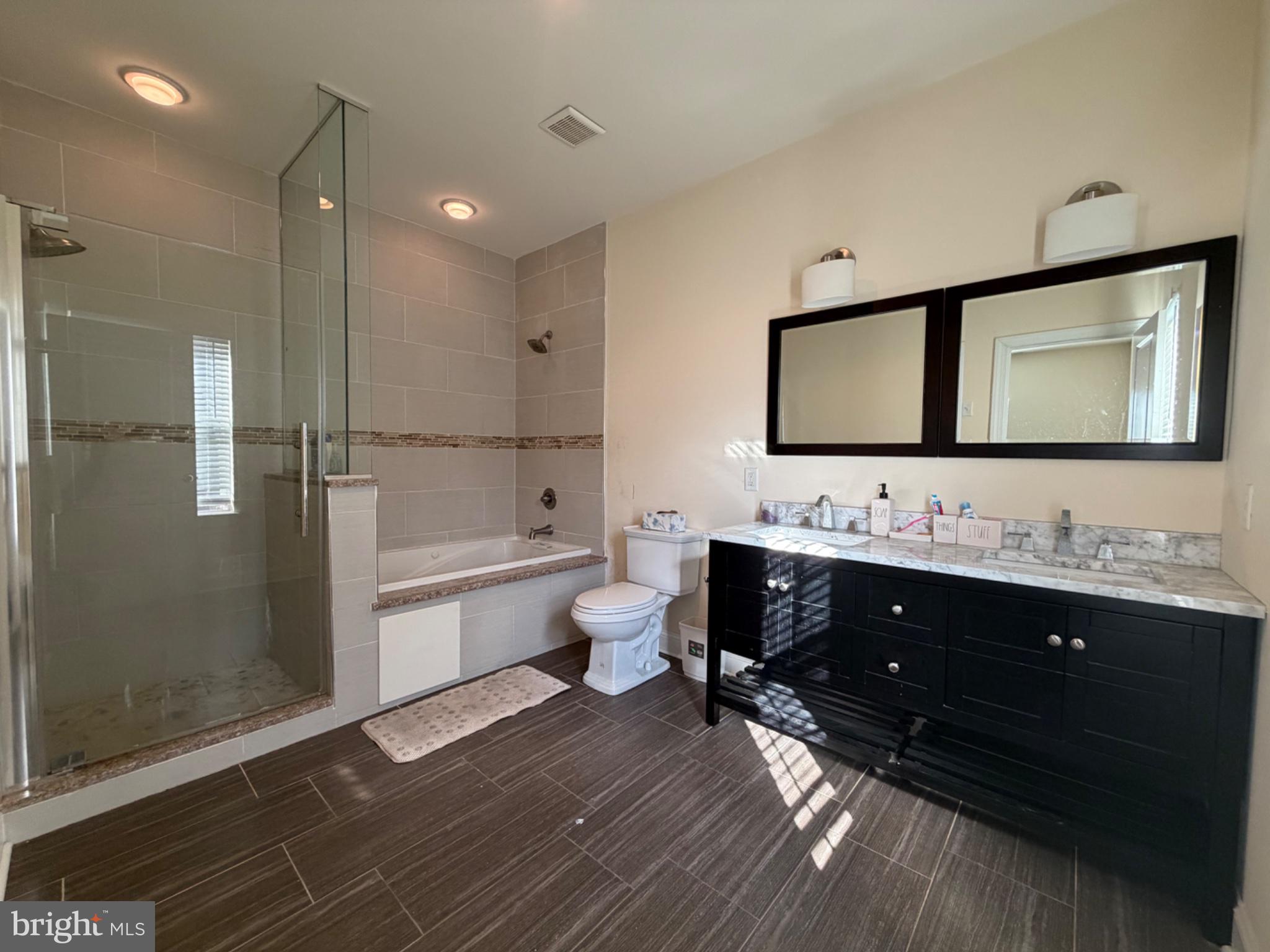 7804 Large Street Philadelphia, PA 19152 - Photo 37 of 42 a bathroom with a double vanity sink a toilet and shower