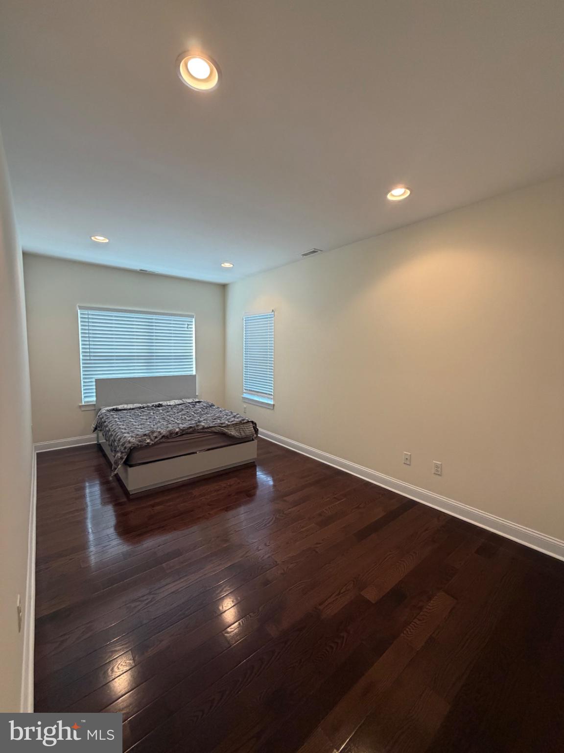 7804 Large Street Philadelphia, PA 19152 - Photo 40 of 42 an empty room with wooden floor table and chairs