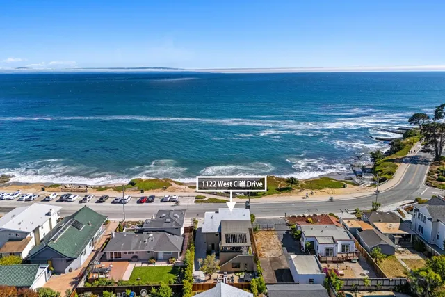 an aerial view of houses with outdoor space