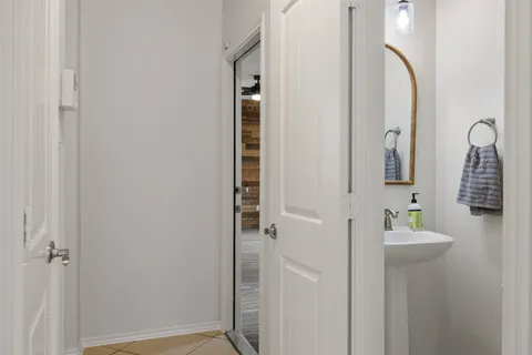 a bathroom with a sink and a mirror
