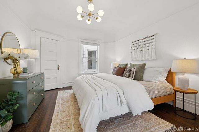 a bedroom with bed and window