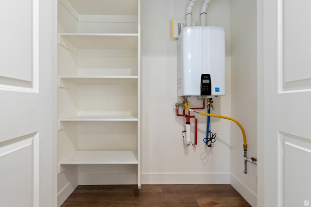 504 North 650 E Street Springville, UT 84663 - Photo 36 of 36 Tankless water heater installation with accessible utility connections and adjacent built-in shelving