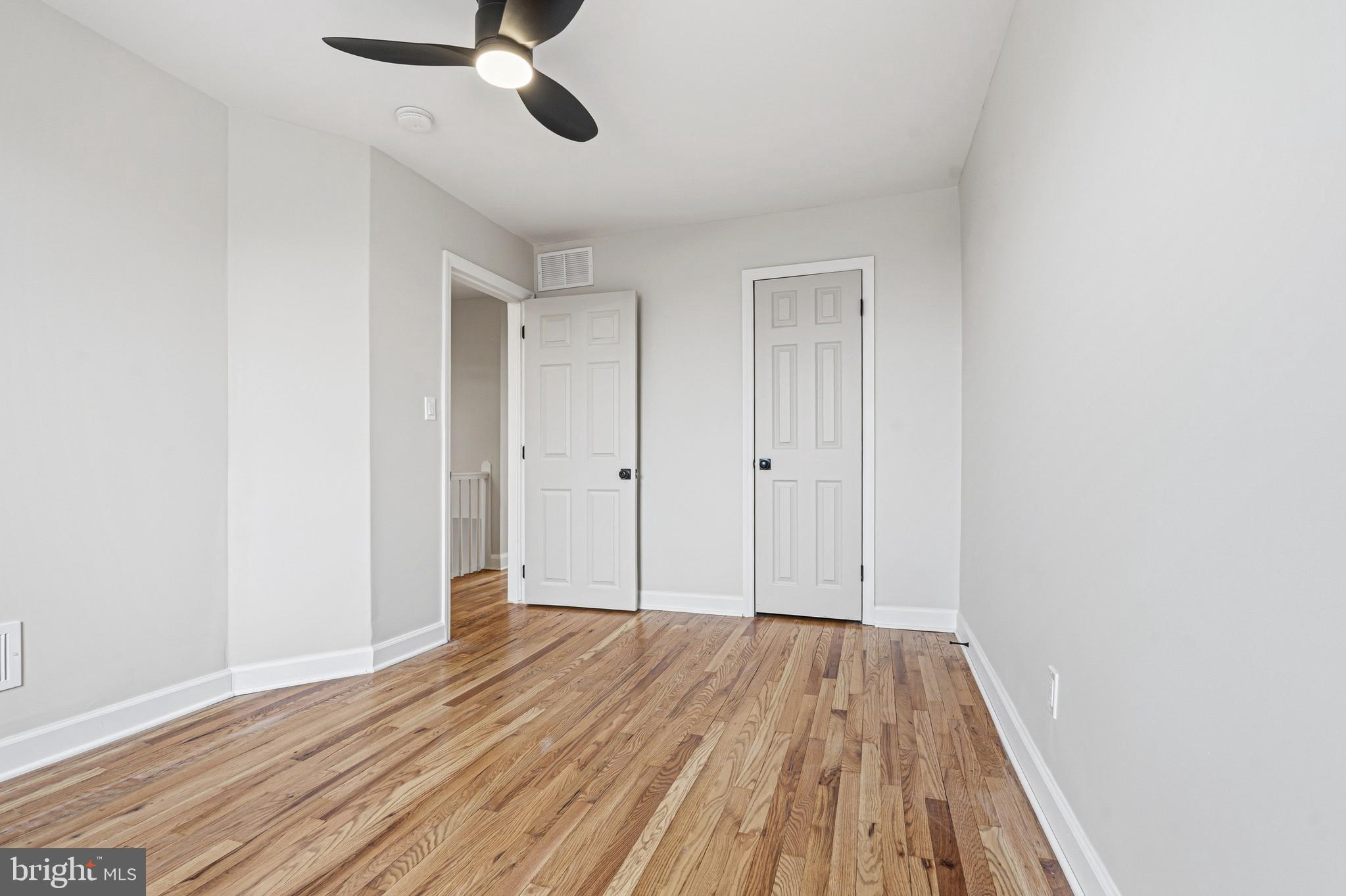 1326 Tompkins Street Baltimore, MD 21225 - Photo 18 of 34 a view of empty room with wooden floor
