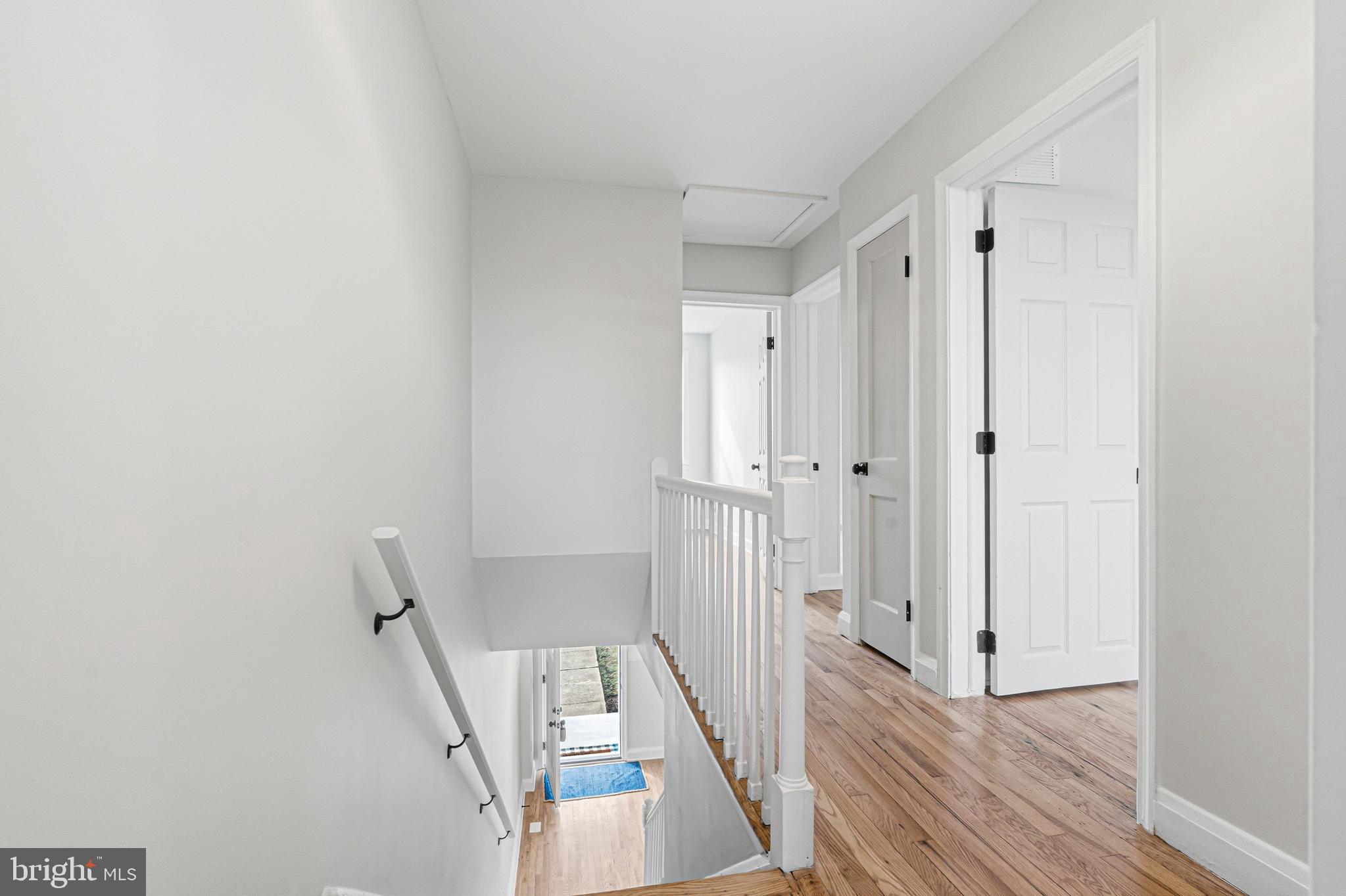 1326 Tompkins Street Baltimore, MD 21225 - Photo 10 of 34 a view of a livingroom with wooden floor and staircase