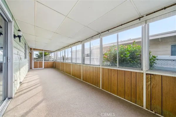 a view of an empty room with a large window