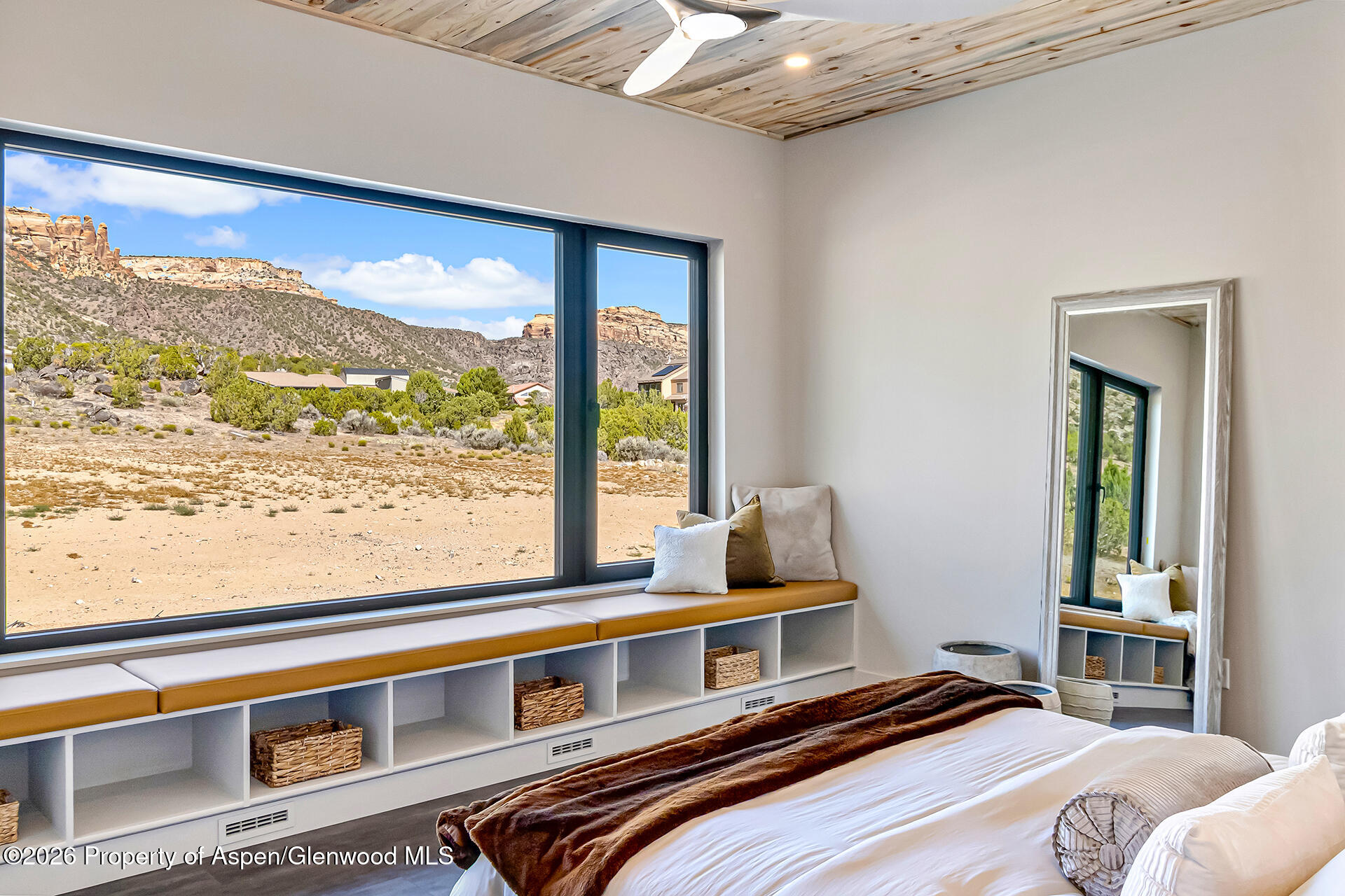 2216 Rimrock Road Grand Junction, CO 81507 - Photo 32 of 84 a bedroom with a bed and a large window with outer view