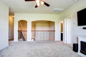 2723 Intrepid Trail Rosenberg, TX 77471 - Photo 20 of 30 Just off the second floor landing is a large game room with a vaulted ceiling and a wall of windows.