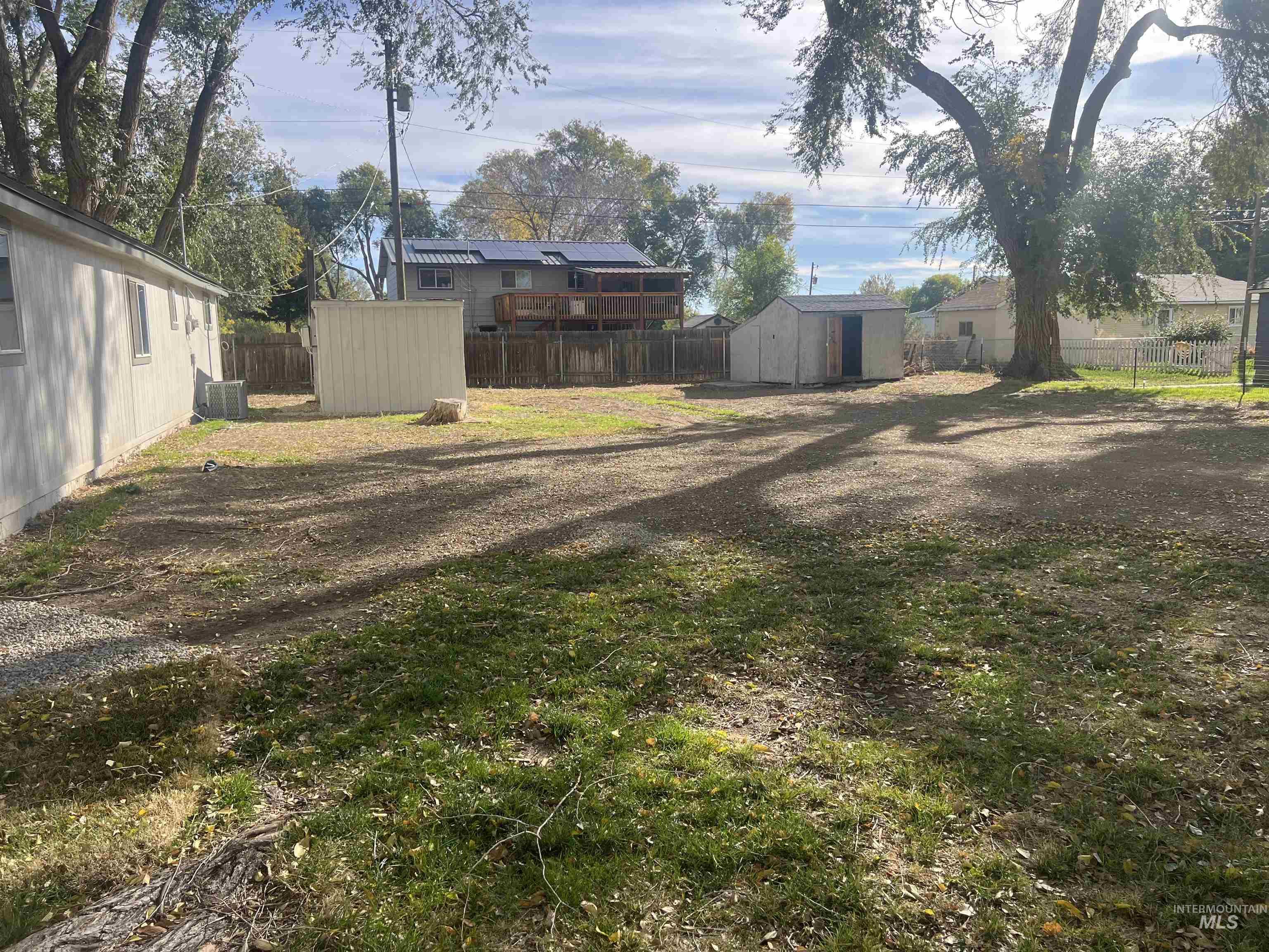 150 Roosevelt Street Mountain Home, ID 83647 - Photo 14 of 16 Fenced backyard with a shed