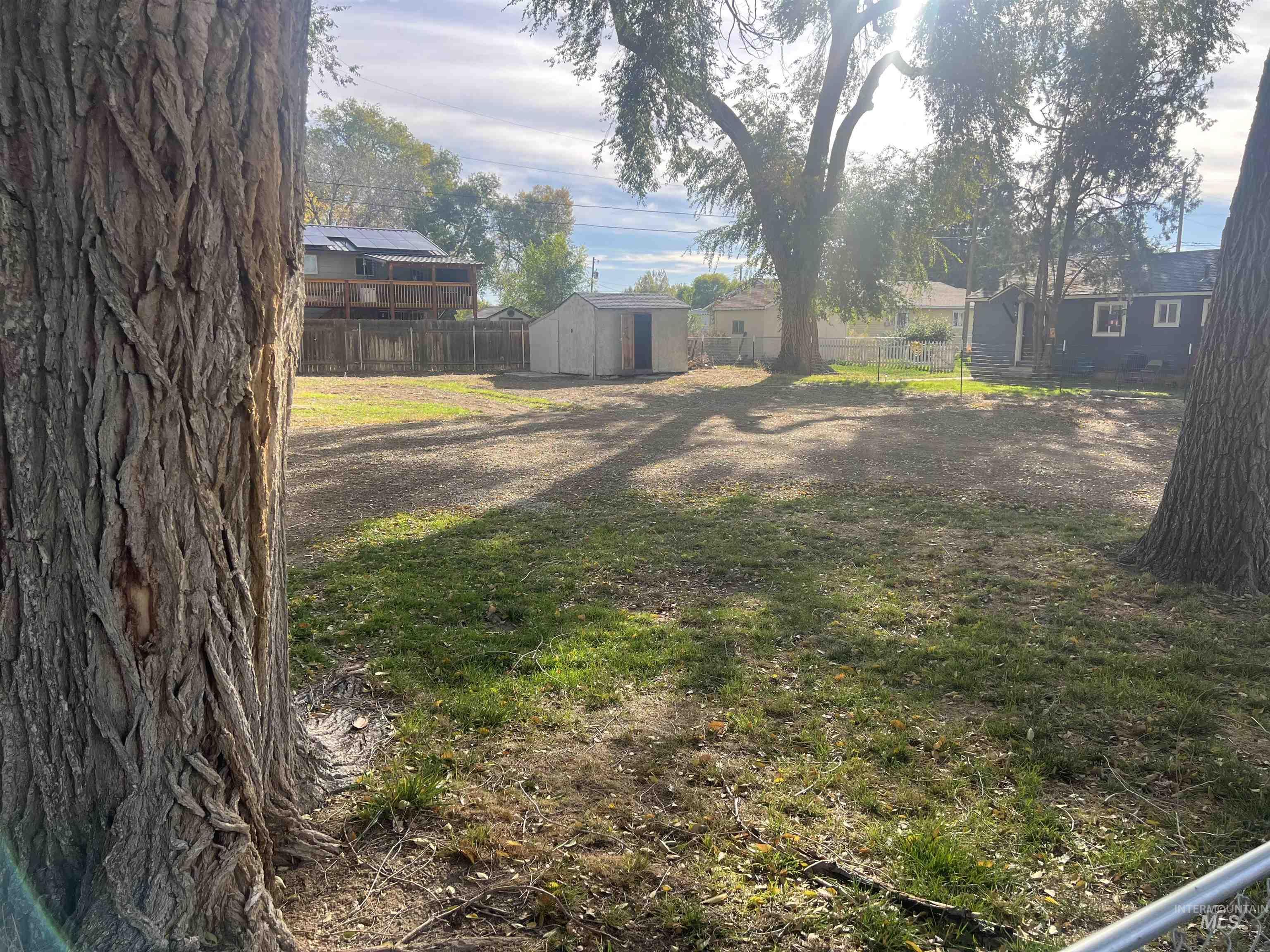 150 Roosevelt Street Mountain Home, ID 83647 - Photo 15 of 16 Fenced backyard featuring a storage shed