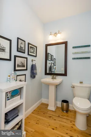 a bedroom with a large bed a flat tv screen and a window