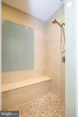 a bathroom with a double vanity sink mirror and toilet