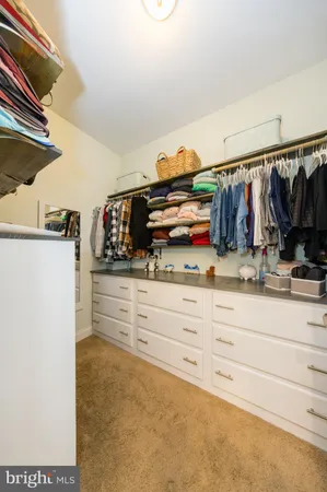 a bedroom with a bed and a table in it