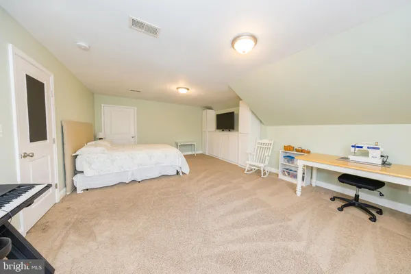 a view of a brick house with a swimming pool