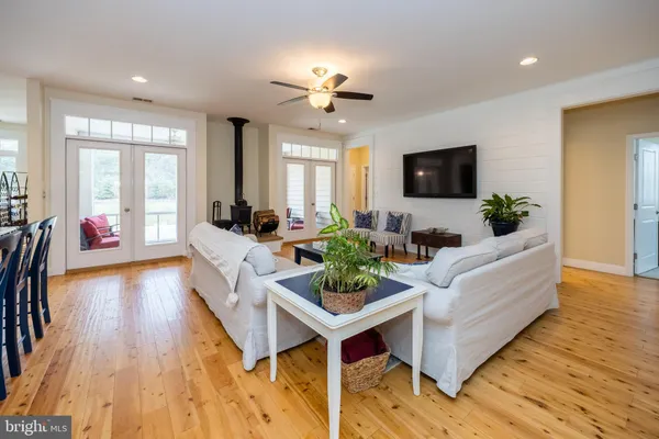 a living room with fireplace furniture and a flat screen tv
