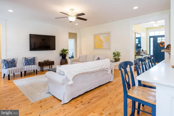 a large kitchen with a table and chairs