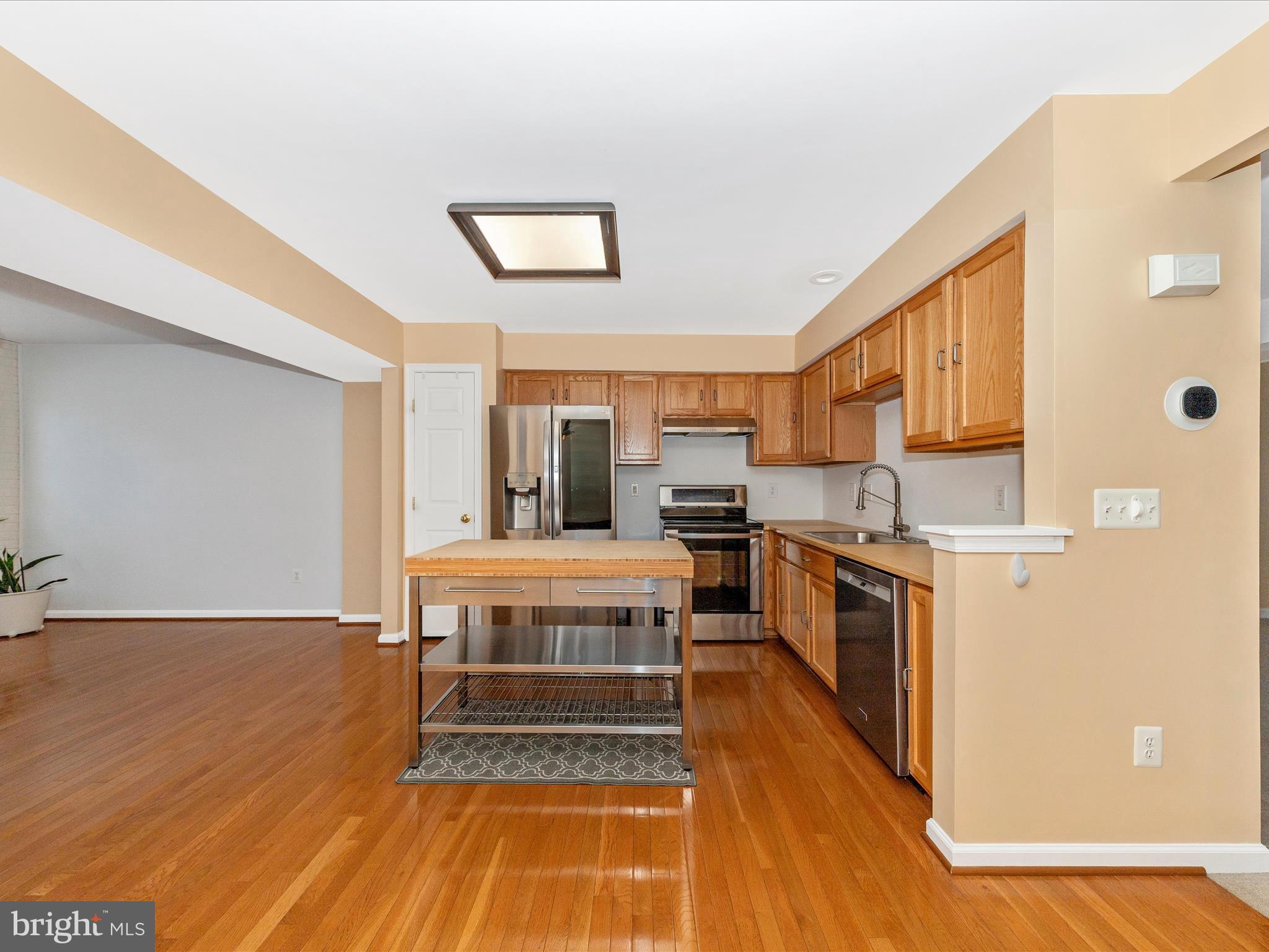 1351 Mare Street Ranson, WV 25438 - Photo 13 of 52 a living room with stainless steel appliances kitchen island granite countertop a stove and a refrigerator