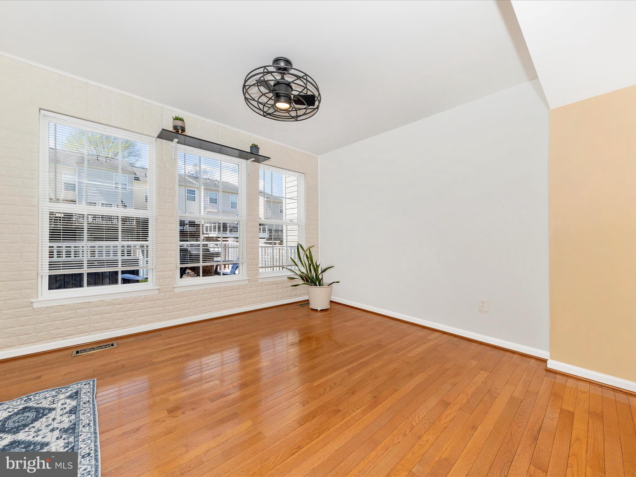 1351 Mare Street Ranson, WV 25438 - Photo 17 of 52 a view of an empty room with a window and wooden floor