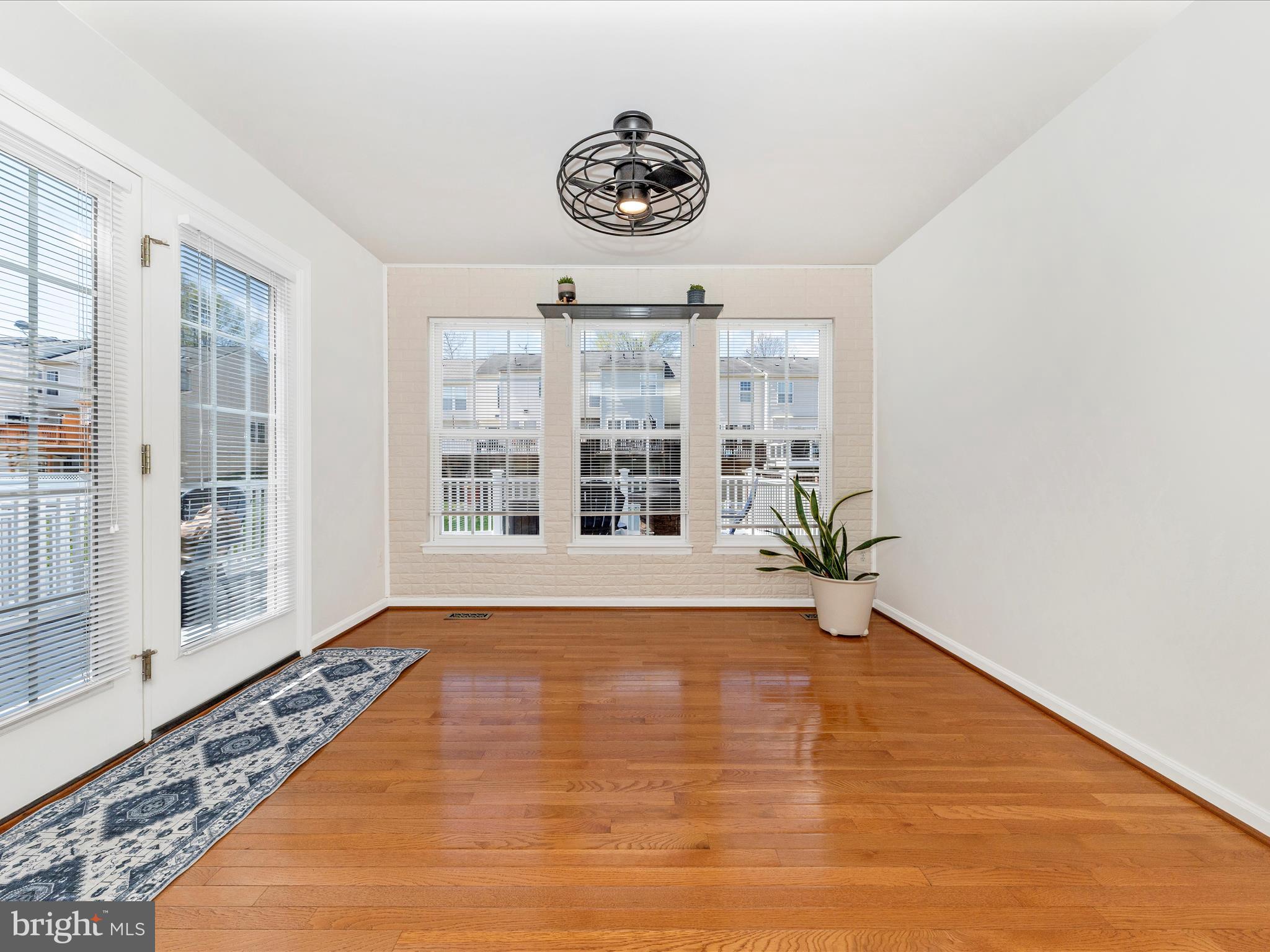 1351 Mare Street Ranson, WV 25438 - Photo 18 of 52 a view of an empty room with a window and wooden floor