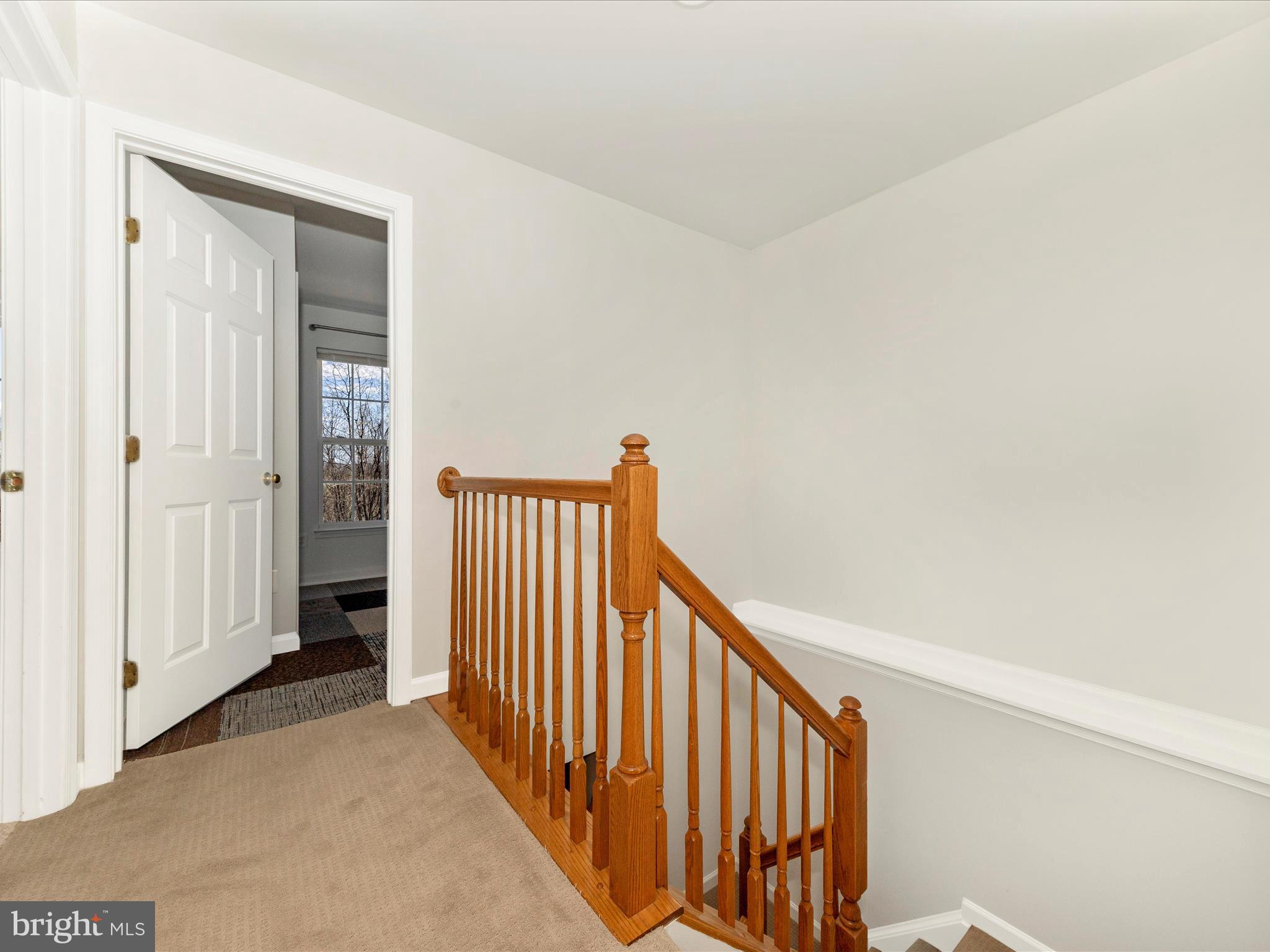 1351 Mare Street Ranson, WV 25438 - Photo 27 of 52 a view of a hallway with wooden floor and stairs