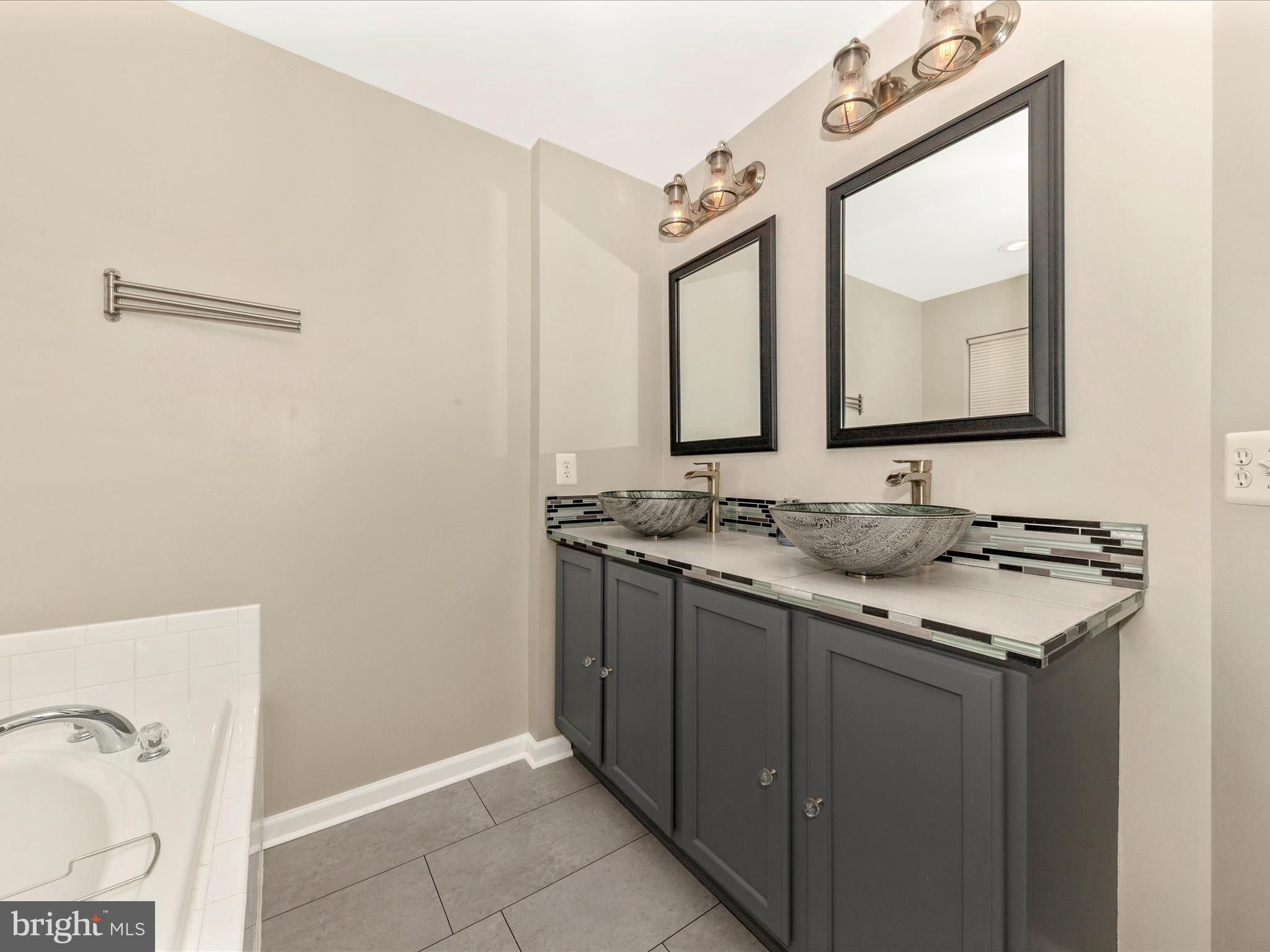 1351 Mare Street Ranson, WV 25438 - Photo 31 of 52 a bathroom with a sink and a mirror