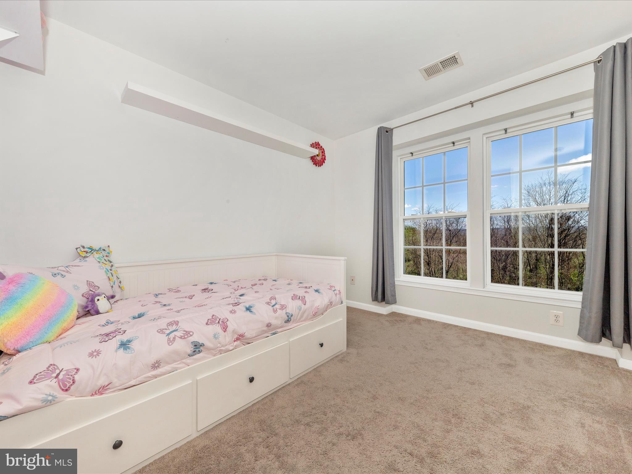 1351 Mare Street Ranson, WV 25438 - Photo 35 of 52 a bedroom with a bed and a large window