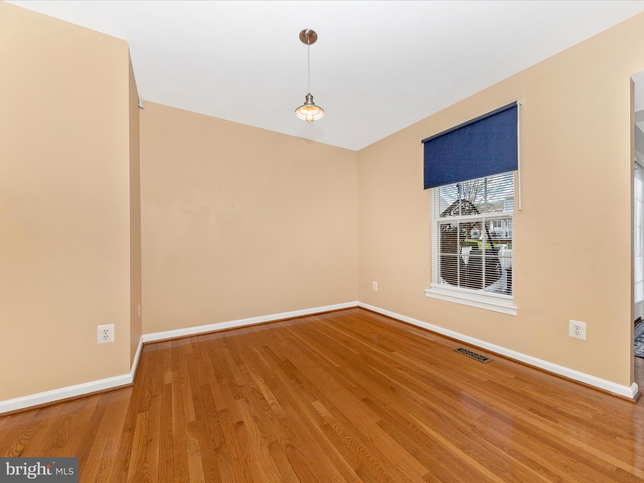 1351 Mare Street Ranson, WV 25438 - Photo 10 of 52 a view of an empty room with wooden floor and a window