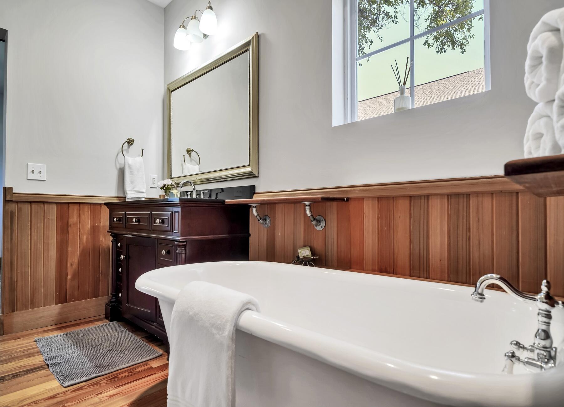 132 Hammock Oaks Boulevard Freeport, FL 32439 - Photo 11 of 45 a bathroom with a bathtub and a mirror