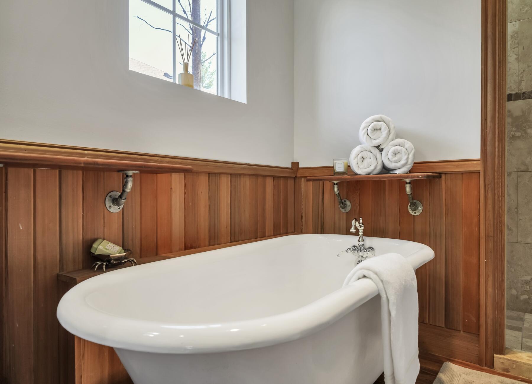 132 Hammock Oaks Boulevard Freeport, FL 32439 - Photo 12 of 45 a bath tub sitting in a bathroom next to a window
