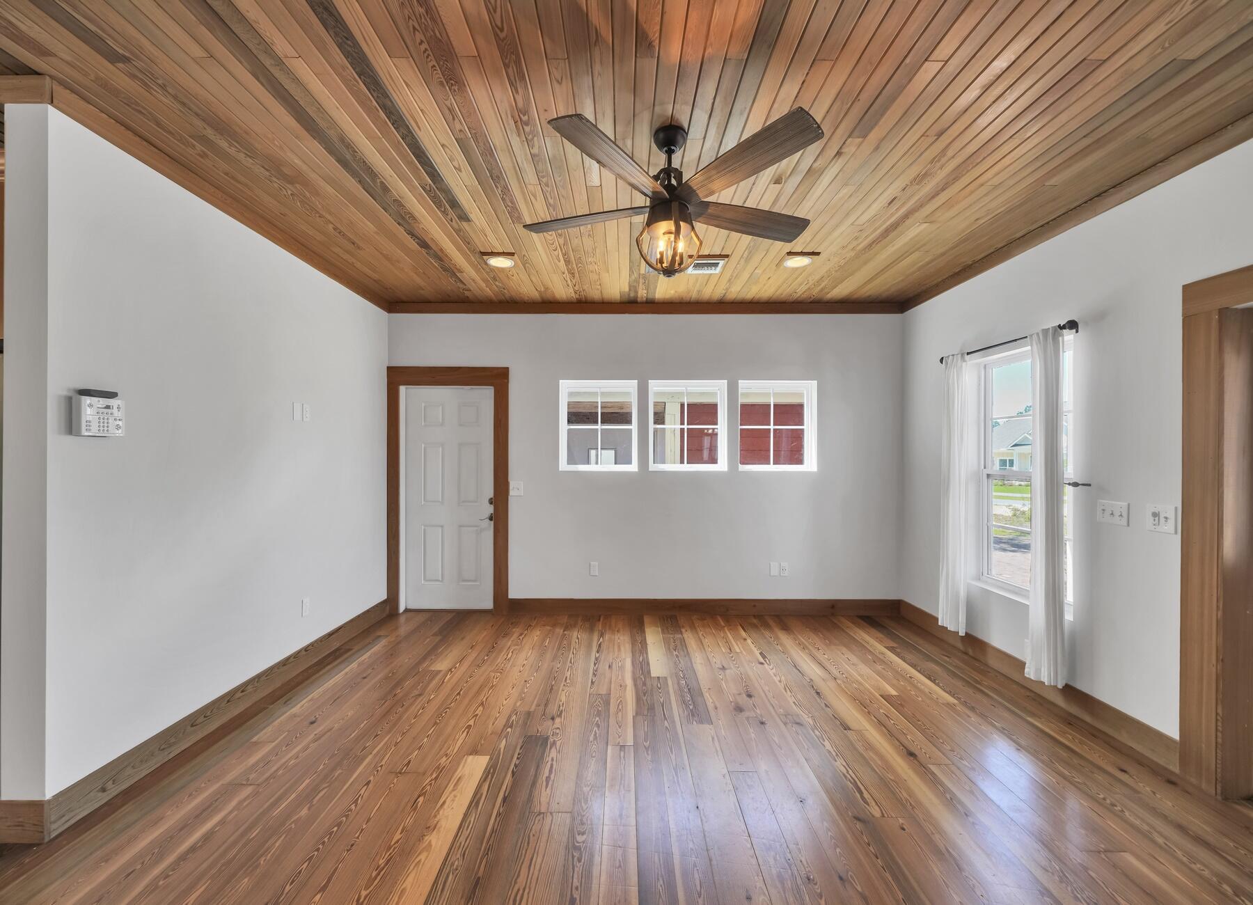 132 Hammock Oaks Boulevard Freeport, FL 32439 - Photo 13 of 45 a view of empty room with wooden floor