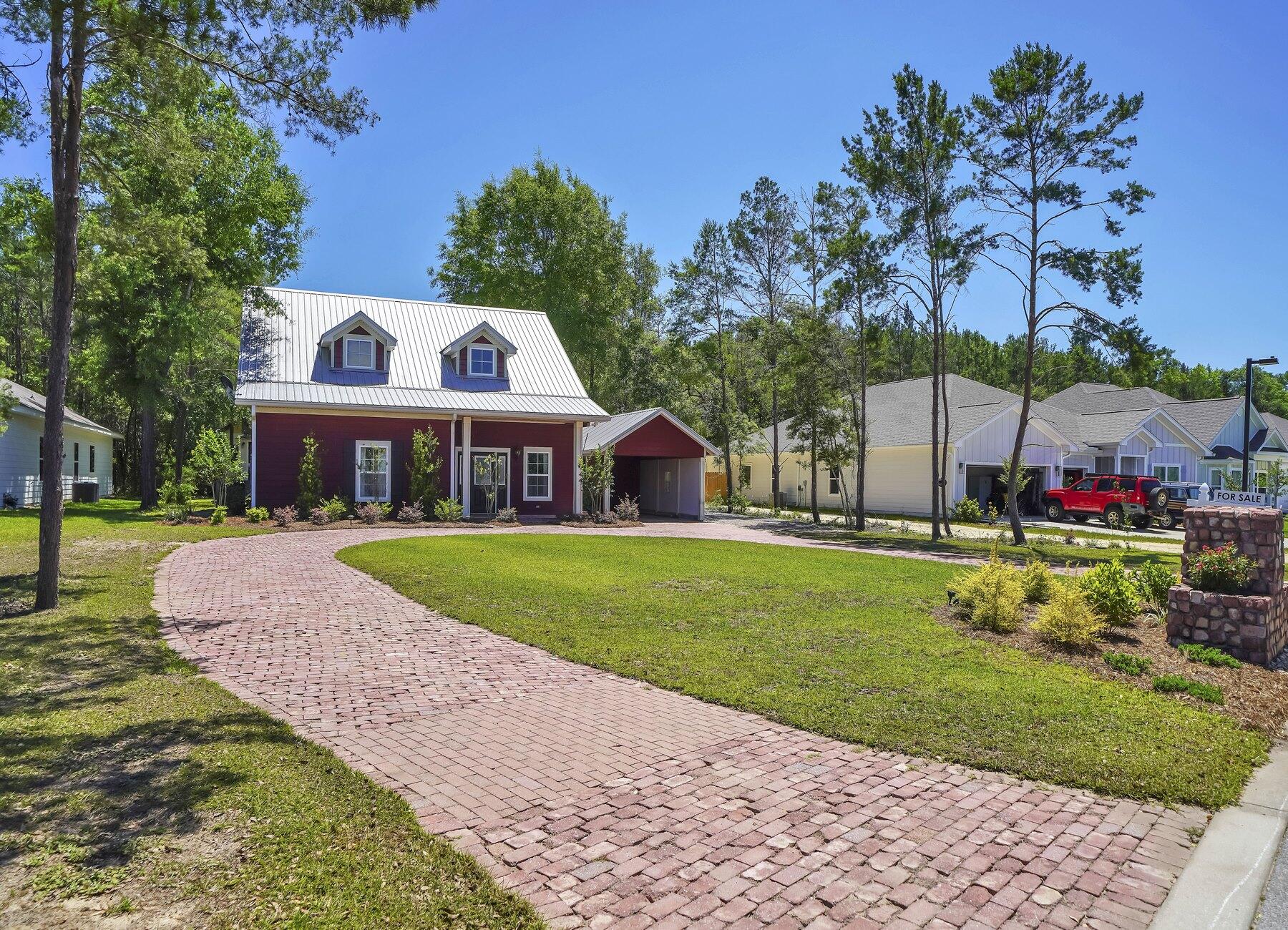 132 Hammock Oaks Boulevard Freeport, FL 32439 - Photo 2 of 45 a front view of house with yard and green space