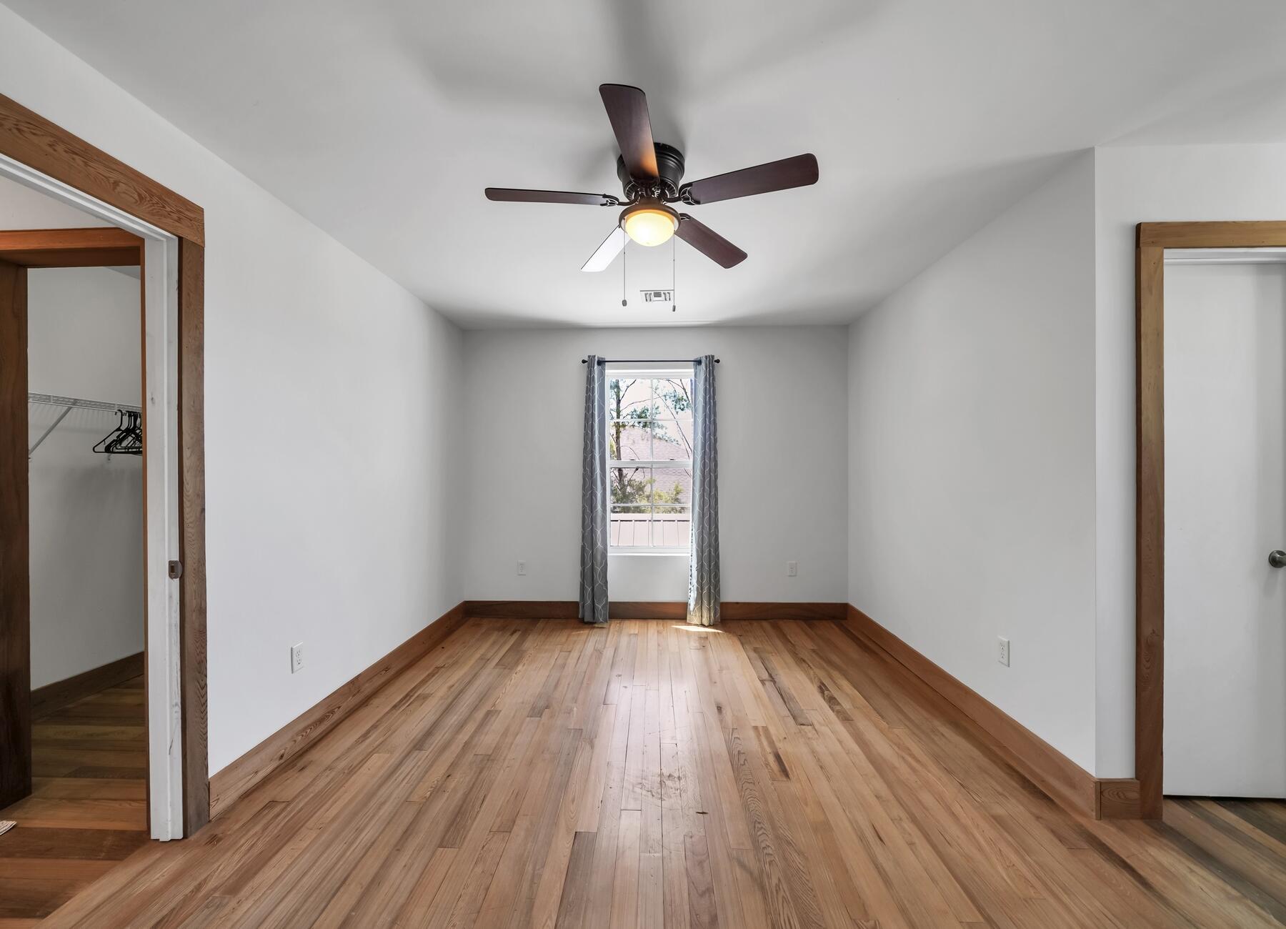 132 Hammock Oaks Boulevard Freeport, FL 32439 - Photo 27 of 45 a view of an empty room window and wooden floor