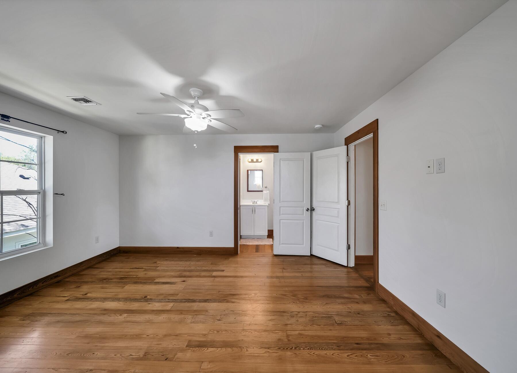 132 Hammock Oaks Boulevard Freeport, FL 32439 - Photo 35 of 45 a view of an empty room with window and wooden floor