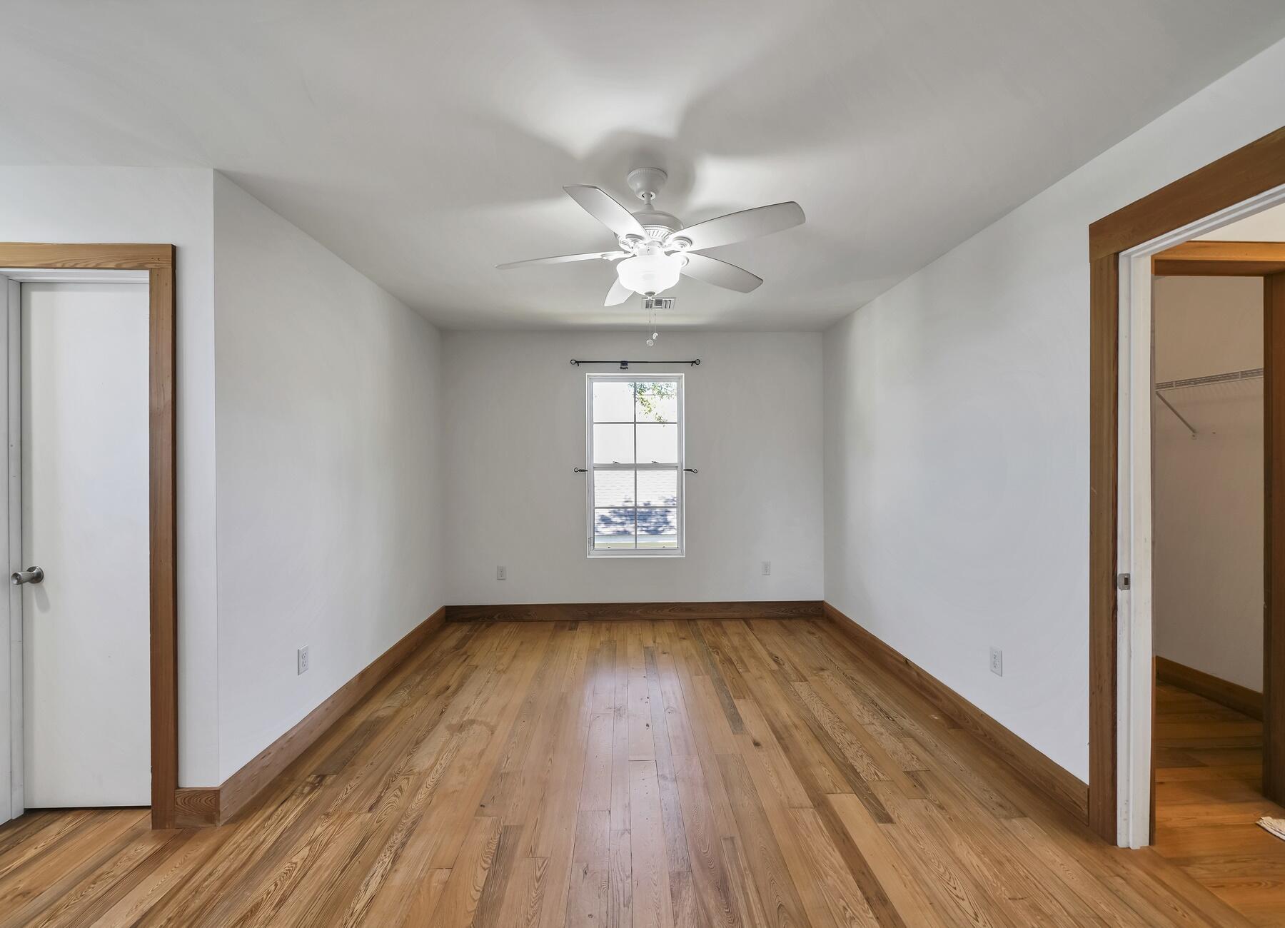 132 Hammock Oaks Boulevard Freeport, FL 32439 - Photo 36 of 45 a view of an empty room with wooden floor and a window