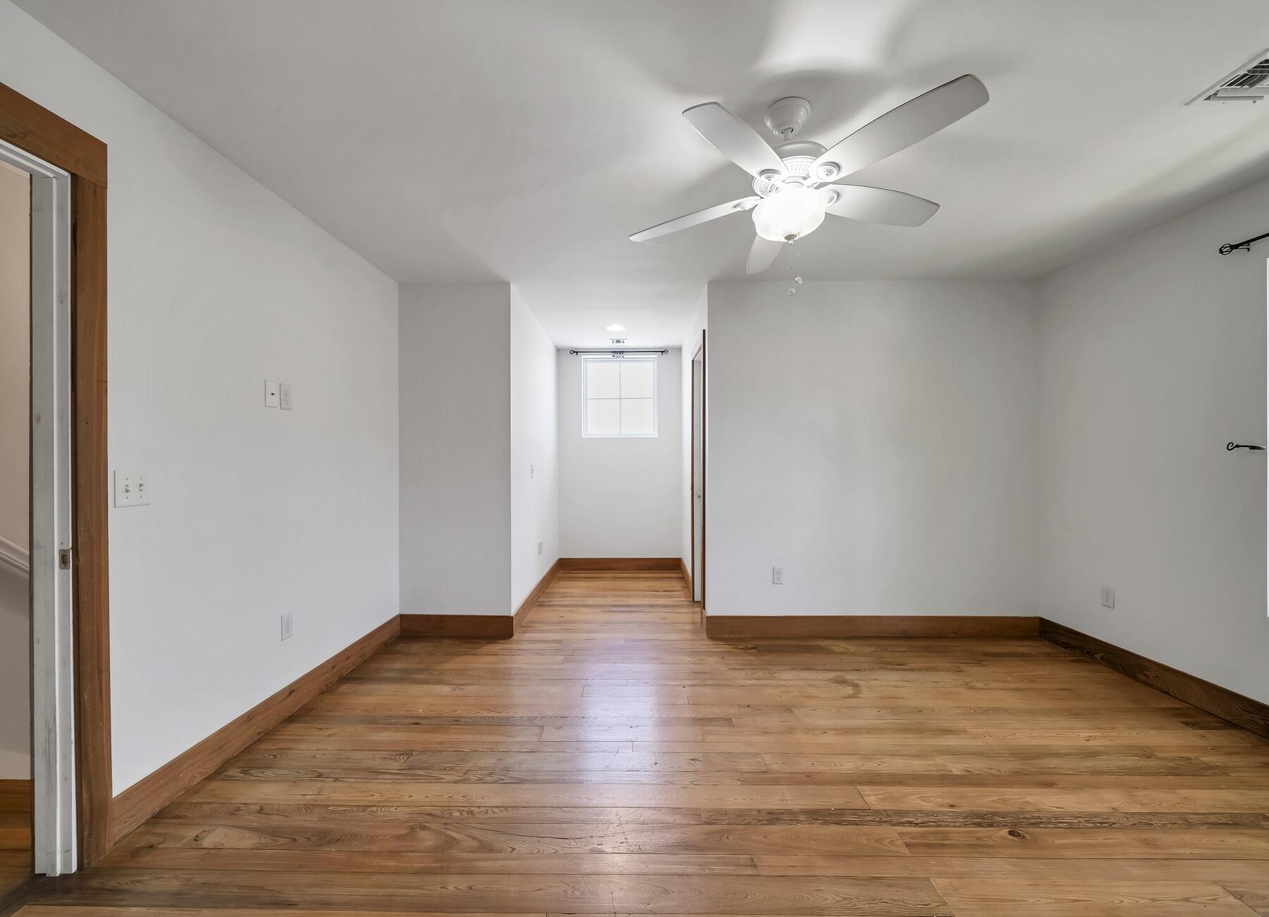 132 Hammock Oaks Boulevard Freeport, FL 32439 - Photo 37 of 45 a view of an empty room with wooden floor