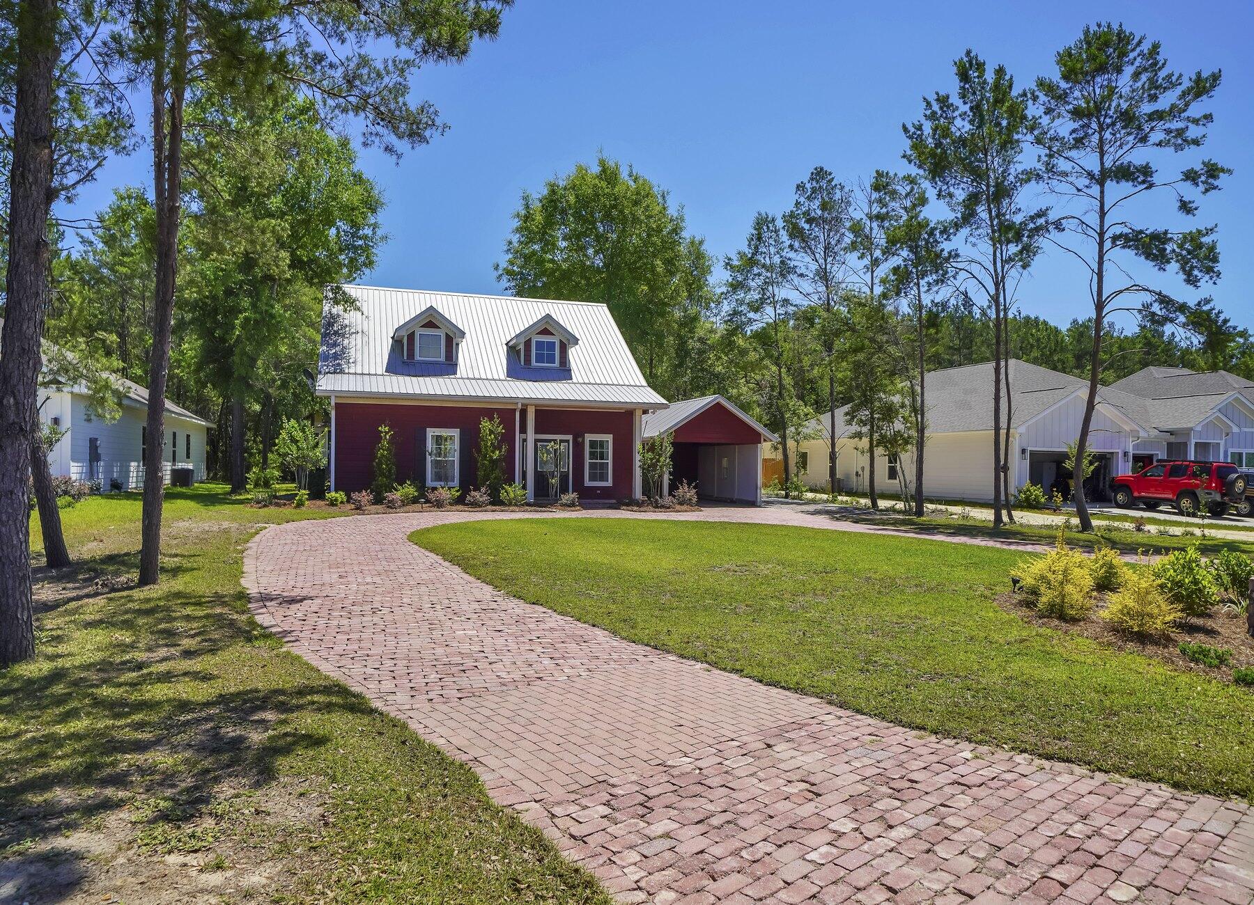 132 Hammock Oaks Boulevard Freeport, FL 32439 - Photo 42 of 45 a front view of house with yard and green space