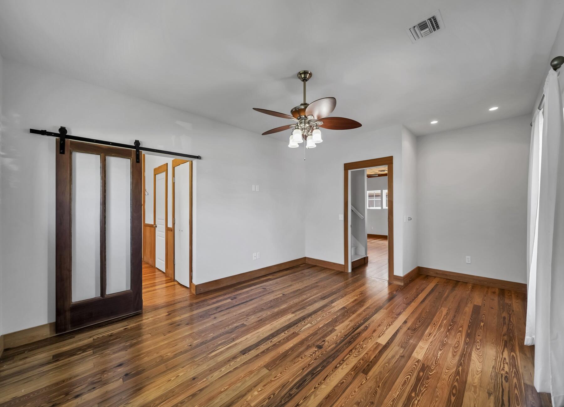 132 Hammock Oaks Boulevard Freeport, FL 32439 - Photo 8 of 45 a view of an empty room with wooden floor