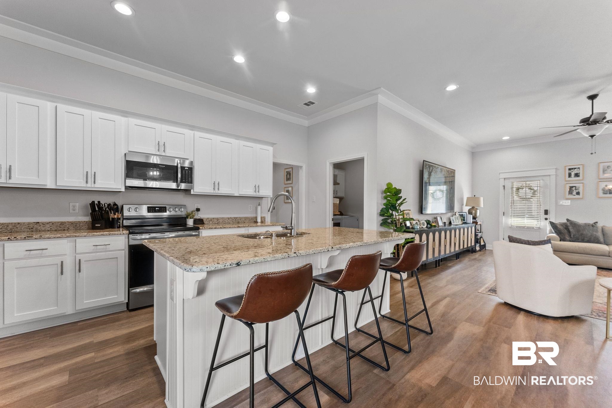 10745 Brodick Loop Daphne, AL 36527 - Photo 37 of 39 Kitchen with open floor plan, stainless steel appliances, white cabinets, light stone counters, and recessed lighting