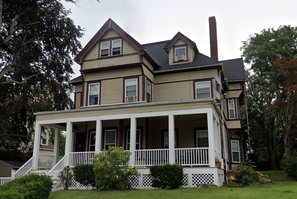 front view of a house with a small yard