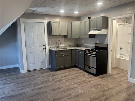 772 Rock Street Fall River, MA 02720 - Photo 2 of 17 a kitchen with stainless steel appliances granite countertop a stove a sink and a refrigerator
