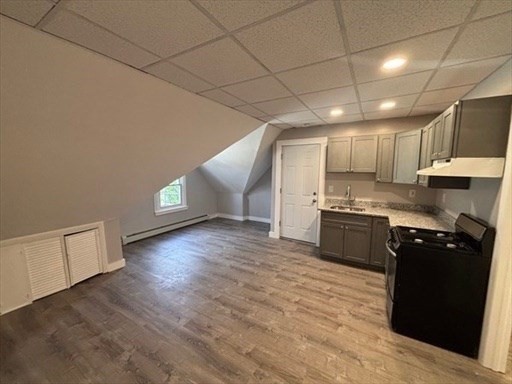 772 Rock Street Fall River, MA 02720 - Photo 3 of 17 a kitchen with granite countertop a stove a sink and a refrigerator